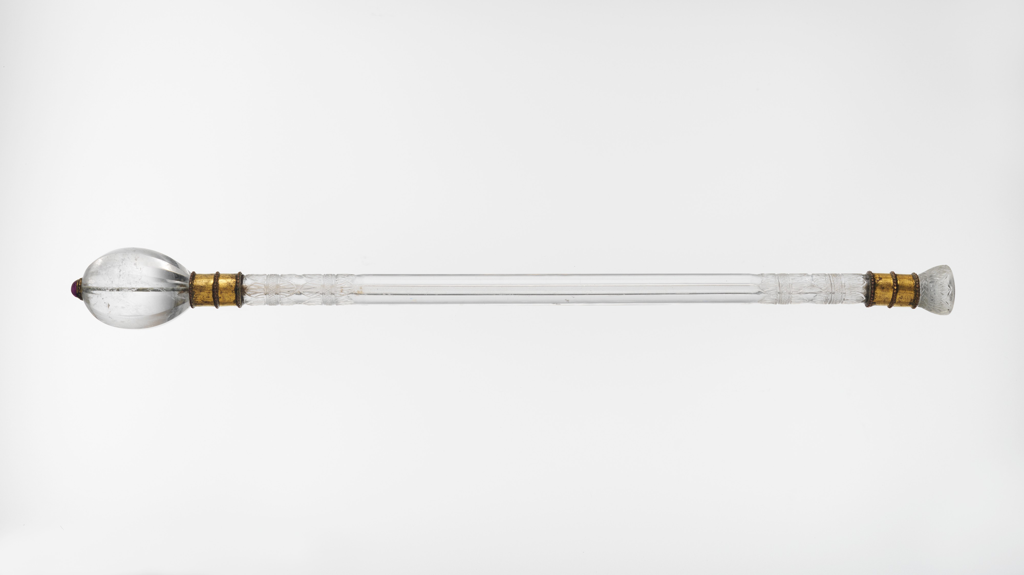An Indian ceremonial mace with a clear glass handle